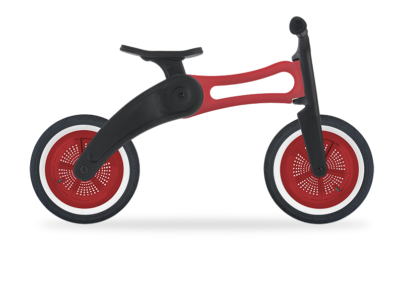 Red recycled running bike. High setting