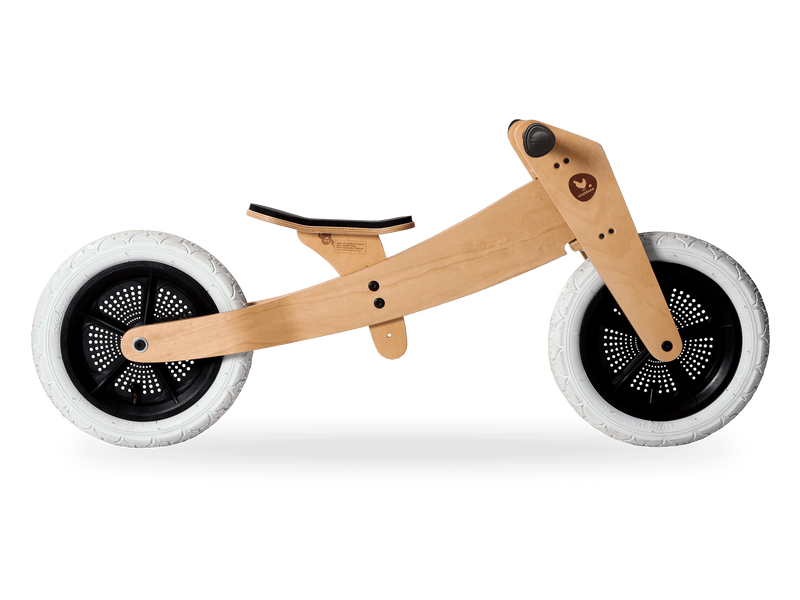 Natural wooden running bike side shot